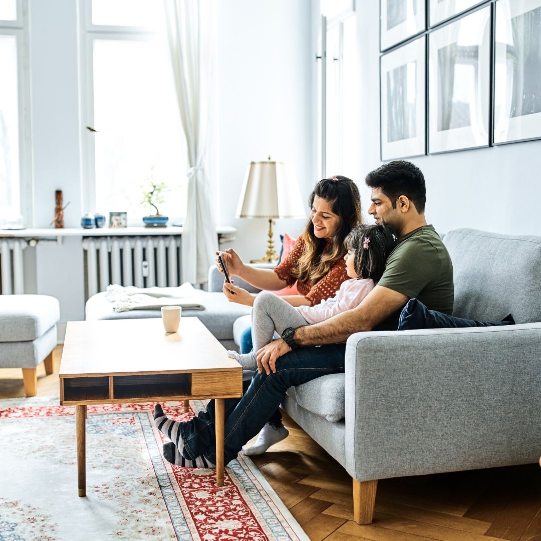 a family sitting in a living room