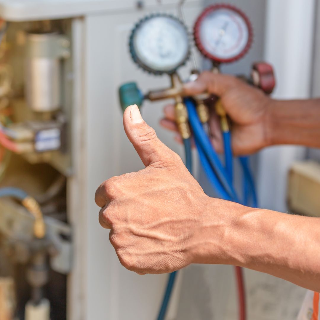 smiling air conditioning repair man