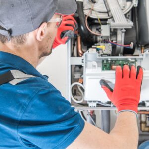 HVAC technician working on a furnace
