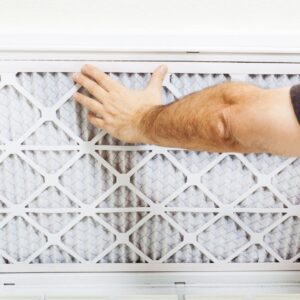 hand pressing on AC vent